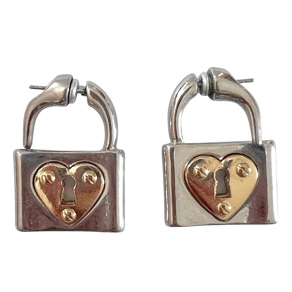silver and gold heart lock earrings.